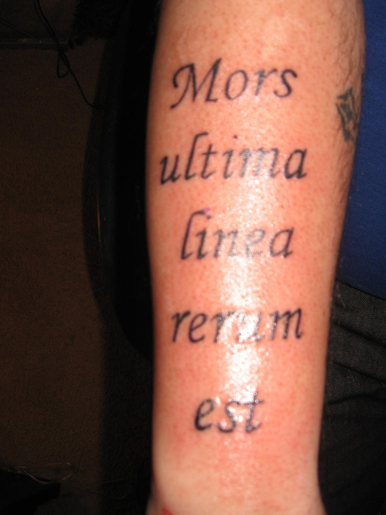 latin tattoo on ribs